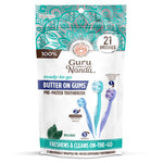Resealable pouch of GuruNanda Butter on Gums pre-pasted travel toothbrushes showing three colored mini brushes and 21 count badge.