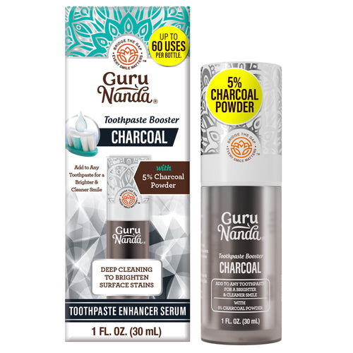 GuruNanda charcoal toothpaste booster serum bottle next to its branded retail box showing product name and 5% charcoal callout