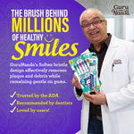 Marketing image of a man in a white coat holding GuruNanda toothbrush packaging with headline about 'millions of healthy smiles'