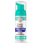 Close-up of a GuruNanda Aligner & Retainer Cleaner foaming pump bottle with teal cap and labeled easy-to-use foam.