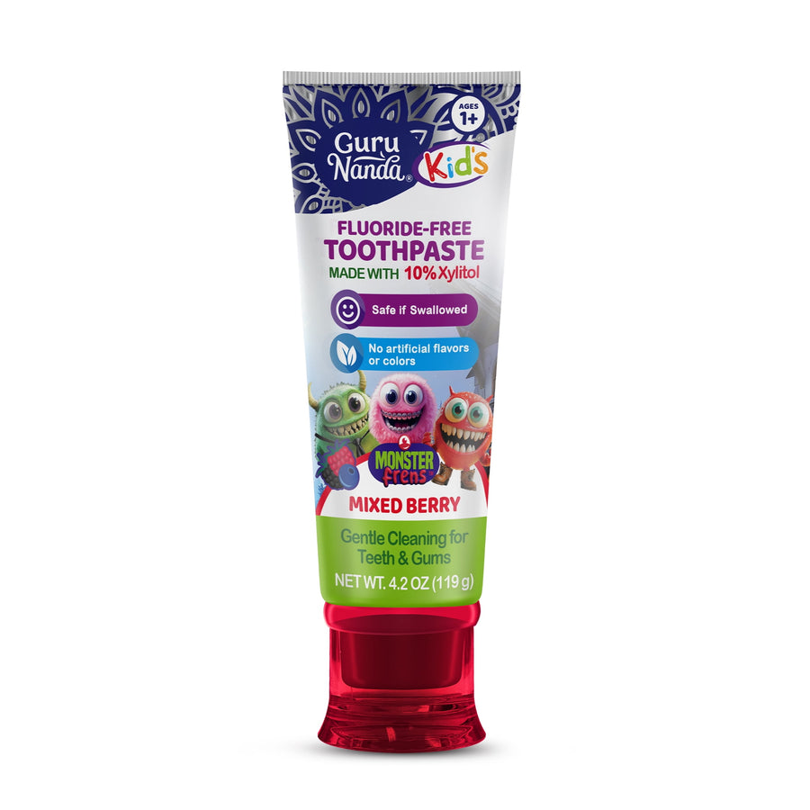 Front-facing tube of GuruNanda Kids fluoride-free mixed berry toothpaste with red flip cap and cartoon monsters on label
