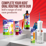 Lifestyle product display of GuruNanda Kids oral care range including toothpaste, oil pulling rinse, flossers and water flosser on podium