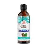 Amber bottle of GuruNanda natural oil pulling oral rinse with teal mandala label and black cap on white background