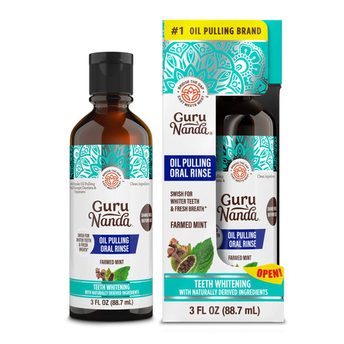 One amber bottle of GuruNanda Farmed Mint oil pulling oral rinse next to its retail box with teal decorative design.