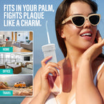 Outdoor lifestyle image of a woman wearing sunglasses holding a GuruNanda palm-sized water flosser with location thumbnails