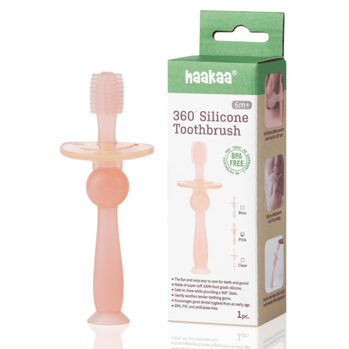 Pink Haakaa 360 silicone baby toothbrush teether shown next to its green-and-white retail box on white background.