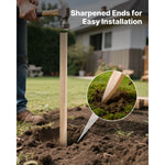 Person hammering a wooden stake into soil with close-up circle showing sharpened stake tip