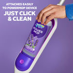 Hand attaching a Swiffer PowerMop lavender solution bottle into the mop handle against a purple background