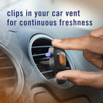 Hand clipping a Febreze AUTO vent freshener into a circular car vent with smoky scent graphics