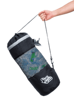 Hand holding a Star brite black mesh trash bag by its cord with suction-cup attachment visible near top