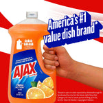 Hand gripping a large Ajax Ultra orange dish soap bottle with bold graphic proclaiming 'America's #1 value dish brand' on red and white background.