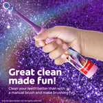 Hand holding a purple Colgate Unicorn Academy power toothbrush against a sparkly purple background with promotional text about a great clean.