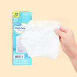 Hand holding a folded translucent trash bag in front of a Great Value drawstring bag box on a pale background