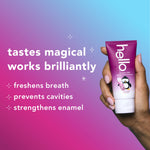 Hand holding a tube of hello Penguin Chill cherry mint toothpaste beside text listing benefits on pink-blue gradient background.