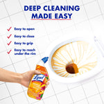 Hand holding Lysol Brand New Day bottle over toilet bowl with gel lines and tiled floor, with cleaning feature text