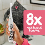 Hand holding a white panda-decorated electric toothbrush next to graphic reading ‘8x more plaque removal’