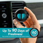 Hand holding a black-and-teal Refresh Your Car mini diffuser in front of a vehicle vent with a banner advertising up to 90 days of freshness