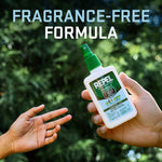 Hand holding a Repel pump spray bottle against a blurred green background with headline reading fragrance-free formula