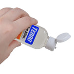 Hand holding a TERRO Ant Killer bottle tipped with the white flip cap open, pouring position