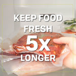 Hand holding a vacuum-sealed marinated piece of meat with bold overlay text claiming 'Keep Food Fresh 5x Longer'