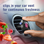 Hand placing a Febreze AUTO berry vent clip into a car vent with scattered berry illustrations and product caption