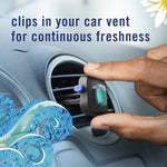 Hand placing a Febreze AUTO ocean breeze vent clip into a round car vent with accompanying decorative water graphics
