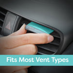 Hand installing a turquoise Refresh vent stick into a car vent with banner text Fits Most Vent Types
