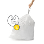 Hand holding the tied top of a white trash bag with a 20 litre / 5.3 gallon label and a yellow E size badge