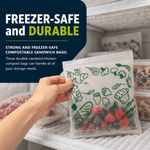 Hand placing a Lunchskins compostable freezer sandwich bag with green food icons into a freezer, filled with berries inside the bag.