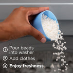 Hand pouring white laundry scent beads from a blue measuring cup into a washing machine with usage steps overlay