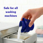 Hand pouring white liquid from a blue measuring cup into a washing machine dispenser with text 'Safe for all washing machines'