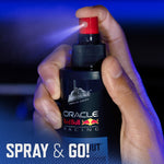 Close-up of a hand pressing the red nozzle of an Armor All Oracle Red Bull Racing 'Lights Out' spray