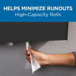 Hand pulling toilet tissue from a dispenser with headline 'Helps Minimize Runouts' and high-capacity rolls message