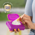 Hand pulling a tissue from a purple Kleenex Snap & Go pack with Clean Shield badge and statistic callout