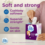 Hand pulling a tissue from a purple Puffs cube with text listing 'Soft and strong' product benefits