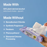 Hand pulling a wipe from an Honest lavender pack with blue background text listing ingredients made with and without