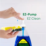 Hand pressing pump to dispense blue Palmolive liquid onto a yellow and green kitchen sponge