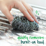 Hand holding a Scotch-Brite stainless steel scrubber scrubbing a metal grill or tray with text overlay