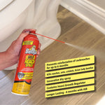 Hand holding Bengal Gold Roach Spray can spraying a thin stream across a bathroom floor with product feature callouts.
