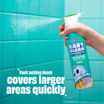 Hand holding and spraying a Scrubbing Bubbles Easy Clean bottle at teal bathroom tile with copy about fast acting foam.