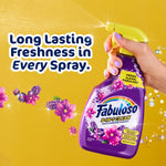 Hand holding Fabuloso lavender spray bottle spraying mist with floral graphics and bold claim text on yellow background