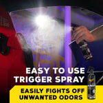 Hand spraying Meguiar’s Air Re-Fresher inside a car, fine mist visible against illuminated interior surfaces.