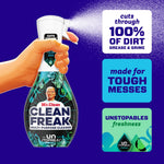 Hand spraying a Mr. Clean Clean Freak trigger bottle with product callouts about cutting 100% of dirt and tough messes.