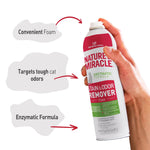 Hand holding and spraying a Nature's Miracle stain & odor remover foam can with infographic callouts