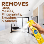 Hand spraying Pledge lemon furniture polish across a kitchen countertop with large copy reading 'REMOVES Dust, Messes, Fingerprints, Smudges & Smears'
