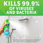 Hand spraying Scrubbing Bubbles aerosol onto tiled shower wall with headline claiming it kills 99.9% of viruses and bacteria