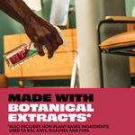 Hand spraying a STEM trigger bottle toward a surface with overlay text 'Made with Botanical Extracts' on a maroon band