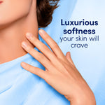 Hand gently touching a soft blue fabric alongside text reading ‘Luxurious softness your skin will crave’.