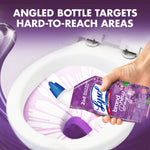 Close-up of a hand angling a Lysol lavender bottle to dispense purple gel under the toilet rim with 'angled bottle' headline.