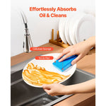 Hand washing a plate with a blue cellulose sponge, annotated to show a cellulose sponge layer and scrub pad.